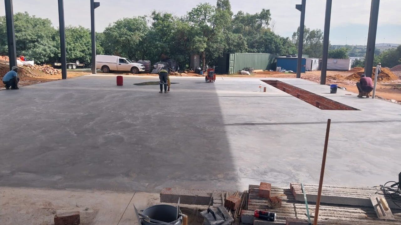 Industrial concrete flooring constructed around a service pit in the Germiston workshop
