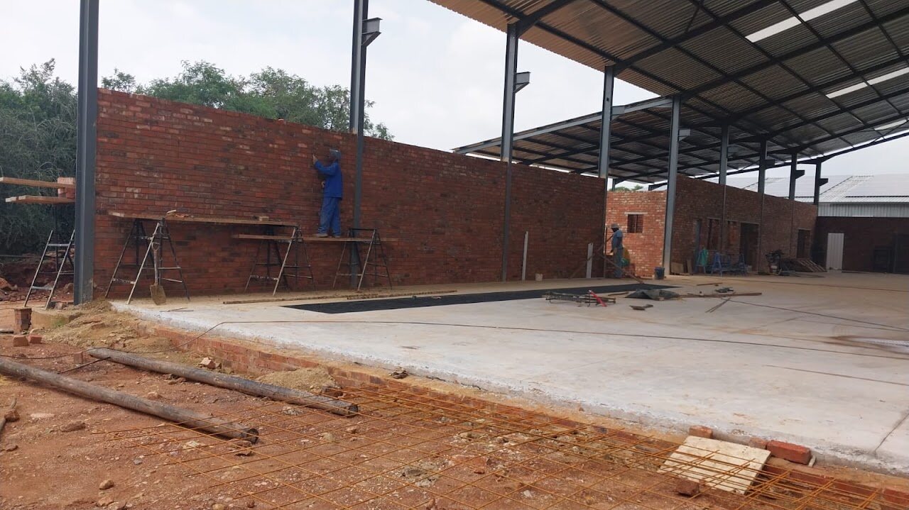 Internal masonry construction and concrete floor within the Germiston industrial workshop
