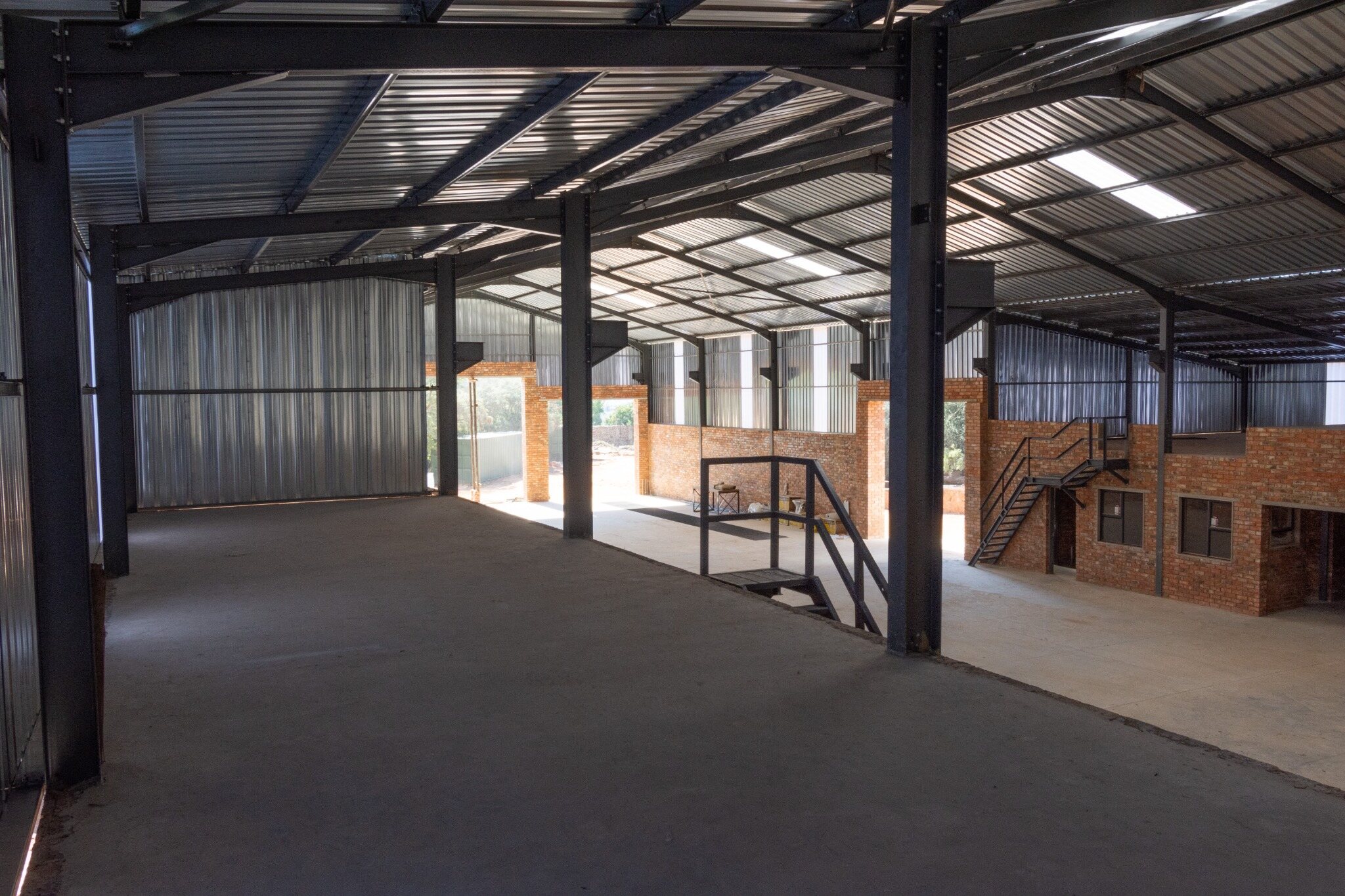 Completed mezzanine level and structural steel interior of the Germiston workshop