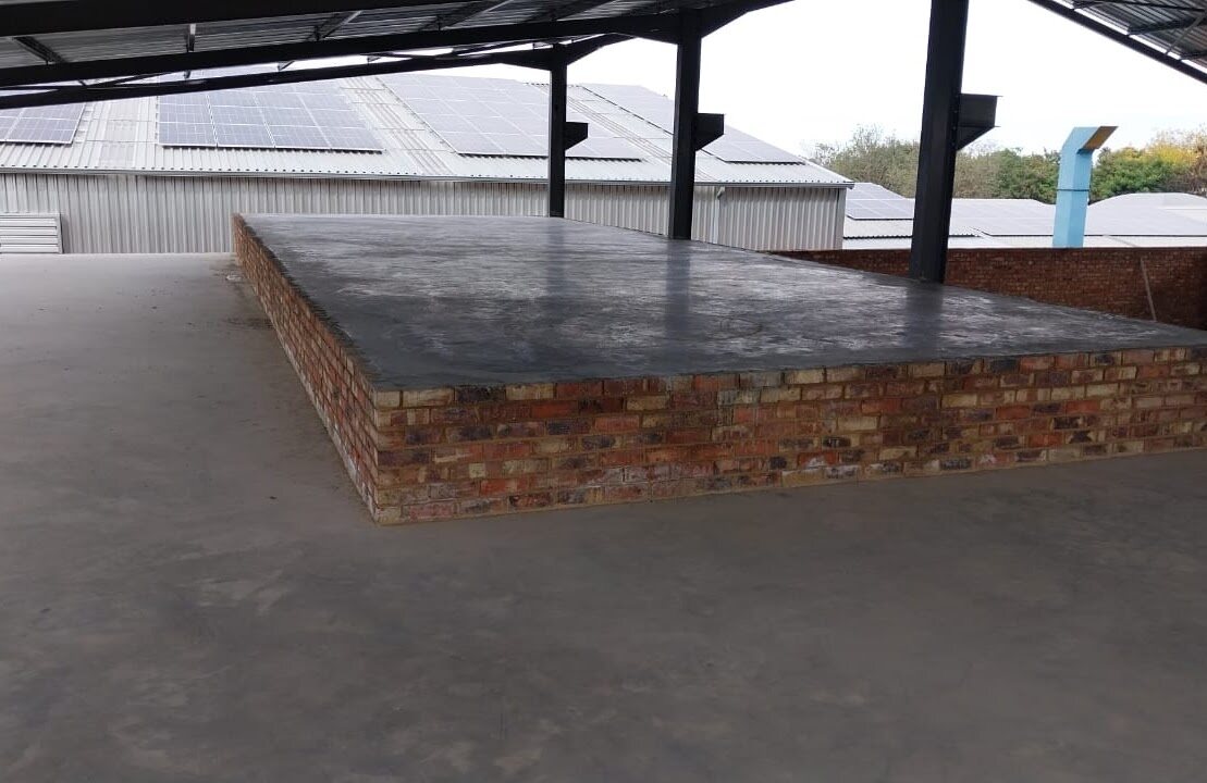 Concrete mezzanine slab under construction inside the industrial workshop