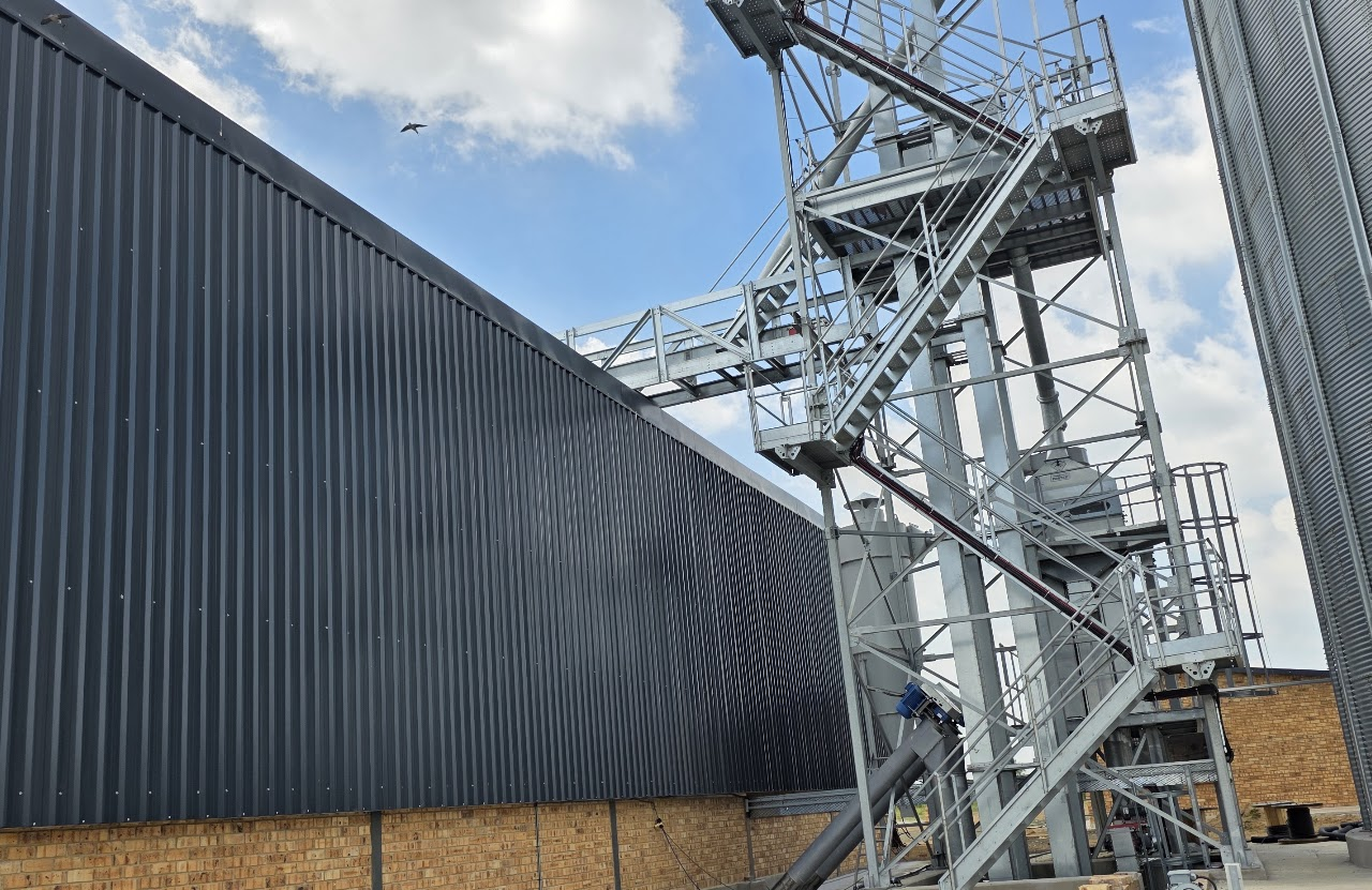Bucket elevator tower, access platforms, stairs and conveyor infrastructure at the Koppies grain site